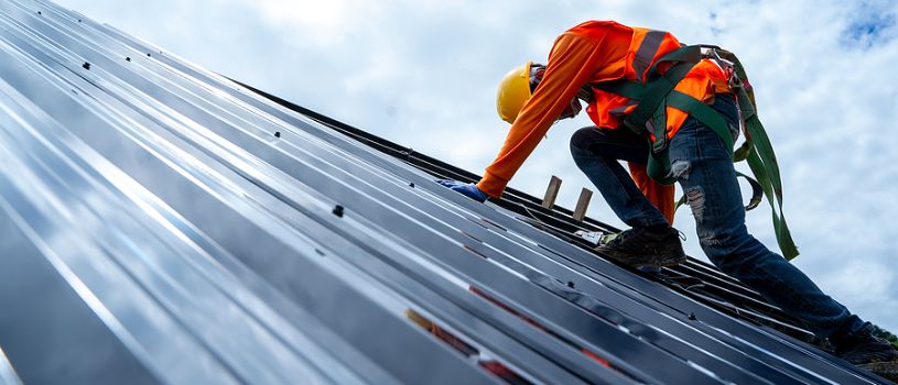 Metal Commercial Roof Being Inspected